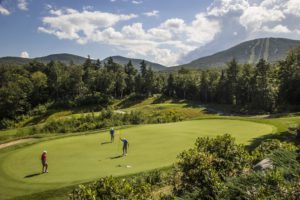 A golf course with people