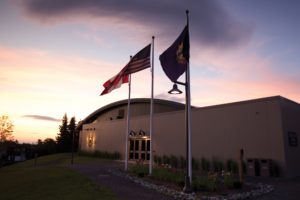 Outside of a facility during a sunset